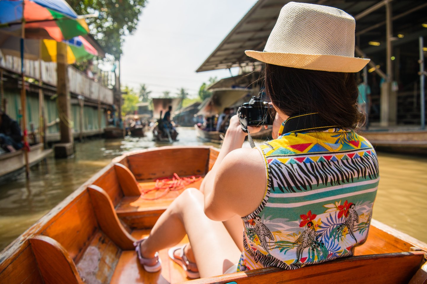 girl visiting Damnoen Saduak floating market